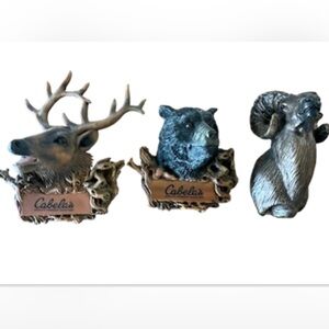 Magnets, a deer, a bear and a mountain goat head